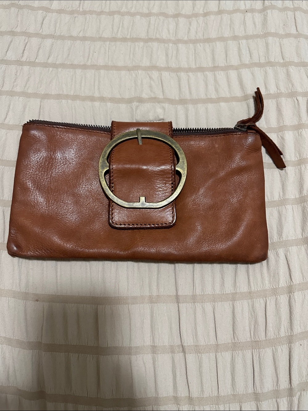 Women's Tan Leather Wristlet Clutch with Decorative Brass Ring
